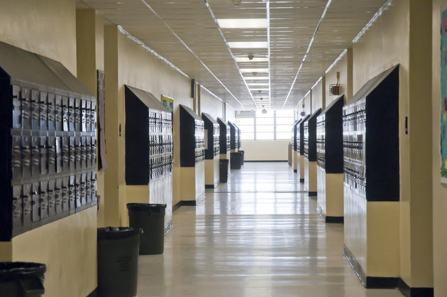 A high school hallway lined with lockers Pat Canova via Getty Images