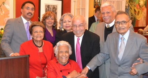 Chef Leah Chase (seated center) and husband Edgar “Dooky” Chase Jr. (far right), surrounded by friends including former 1st Lady Sybil Morial (l); Mr. & Mrs. Ronnie Burns (President & CEO QCS Logistics); Mr. & Mrs. Norman Francis (Xavier Univ. President Emeritus); and Mr. & Mrs. Alden McDonald (President & CEO, Liberty Bank) as they celebrate both Leah Chase’s 93rd birthday and the 75th anniversary of Dooky Chase’s Restaurant Photo credit: Vincent Sylvain