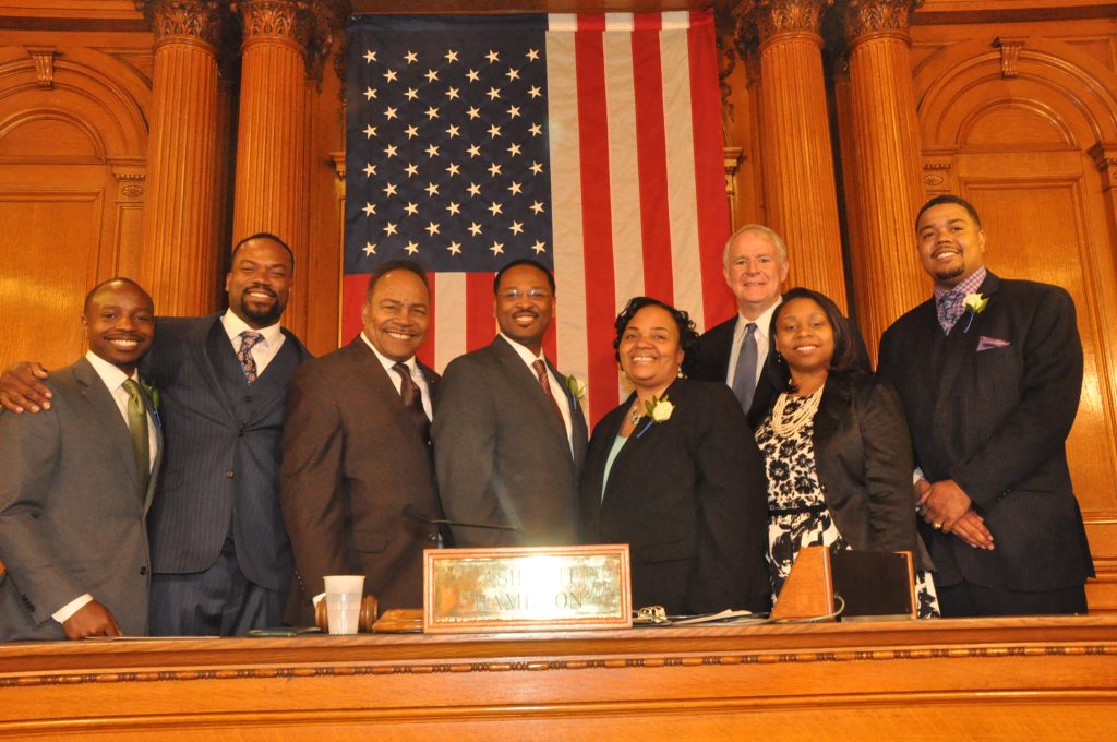 Hamilton poses with Mayor Tom Barrett, City Treasurer Spencer Coggs, and the other Black members of the council for a group picture after the official ceremony. - photo by Yvonne Kemp