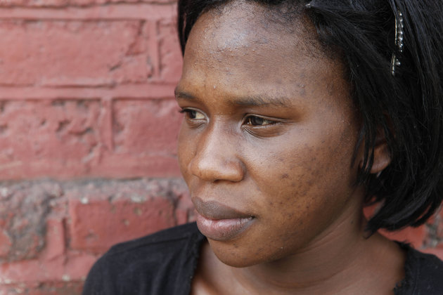 In this photo taken Jan. 14, 2011, Mikeisha Simpson poses for a portrait in Kingston, Jamaica. Simpson, 23, hopes to transform her dark complexion to a cafe-au-lait-color common among Jamaica's elite and favored by many men in her neighborhood. She believes a fairer skin could be her ticket to a better life, so she spends her savings on black-market concoctions that promise to lighten her pigment. (AP Photo/Caterina Werner)