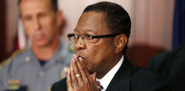 Kip Holden, Mayor-President of East Baton Rouge Parish, speaks at a news conference with Baton Rouge police chief Carl Dabadie, Jr., behind, at police headquarters in Baton Rouge, La., Wednesday, July 6, 2016. The Mayor-President and police chief were responding to the shooting by police officers of Alton Sterling, who was killed outside a convenience store where he was selling CDs. (AP Photo/Gerald Herbert)