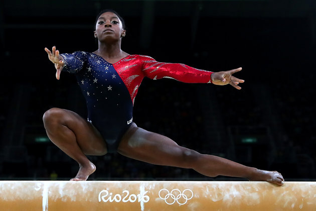 RIO DE JANEIRO, BRAZIL - AUGUST 07: Simone Biles of the United States competes on the balance beam during Women's qualification for Artistic Gymnastics on Day 2 of the Rio 2016 Olympic Games at the Rio Olympic Arena on August 7, 2016 in Rio de Janeiro, Brazil (Photo by Tom Pennington/Getty Images)