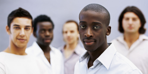 portrait of five young men standing together